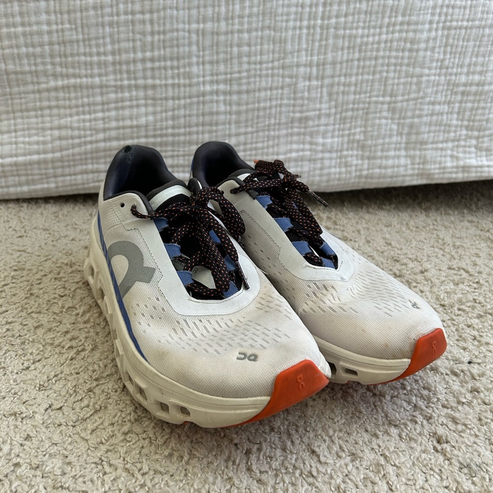 On Running White and Black Athletic Shoes with Chunky Sole